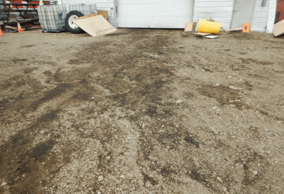 Evidence of spills outside a shop at the Margaret Lake camp. Photo: GNWT